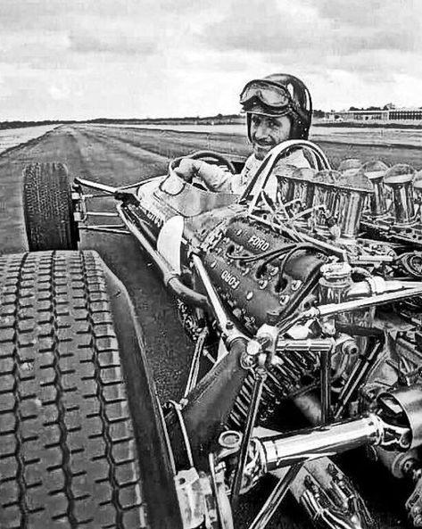 Graham Hill in a racing car.