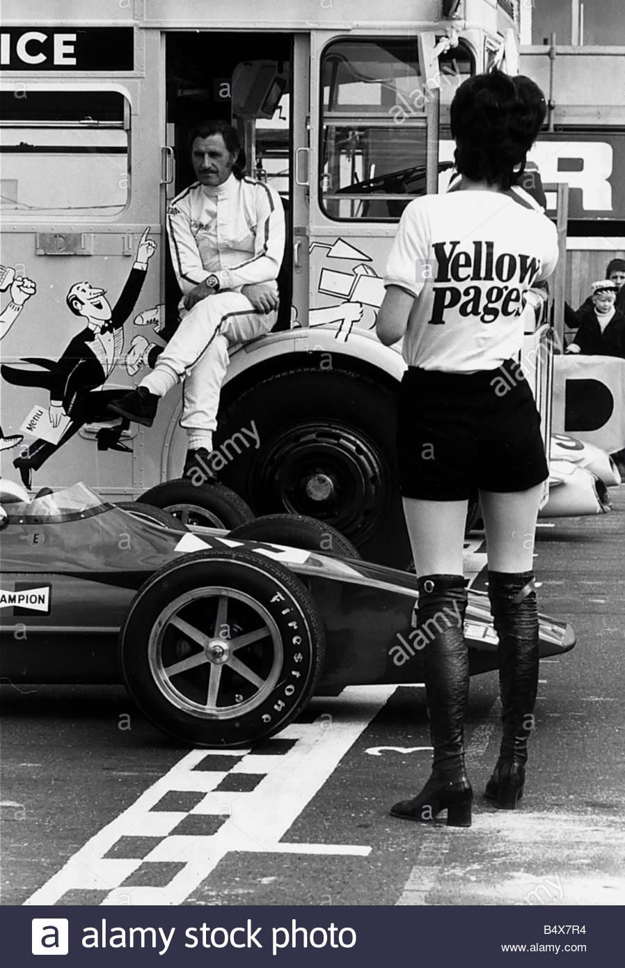 Graham Hill with a “yellow pages” girl in 1971.