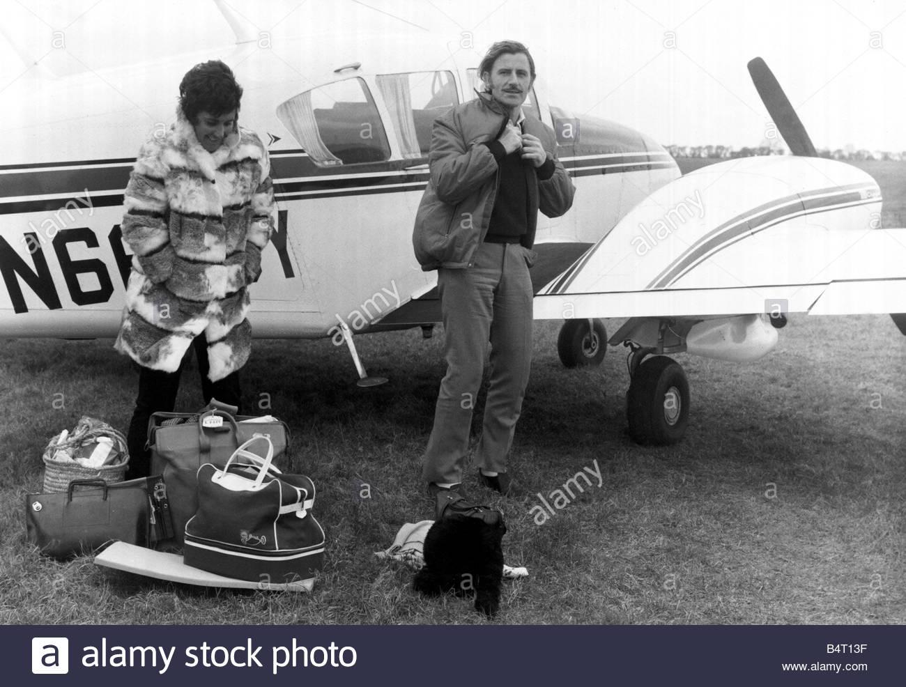 Graham Hill and Bette beside their plane.