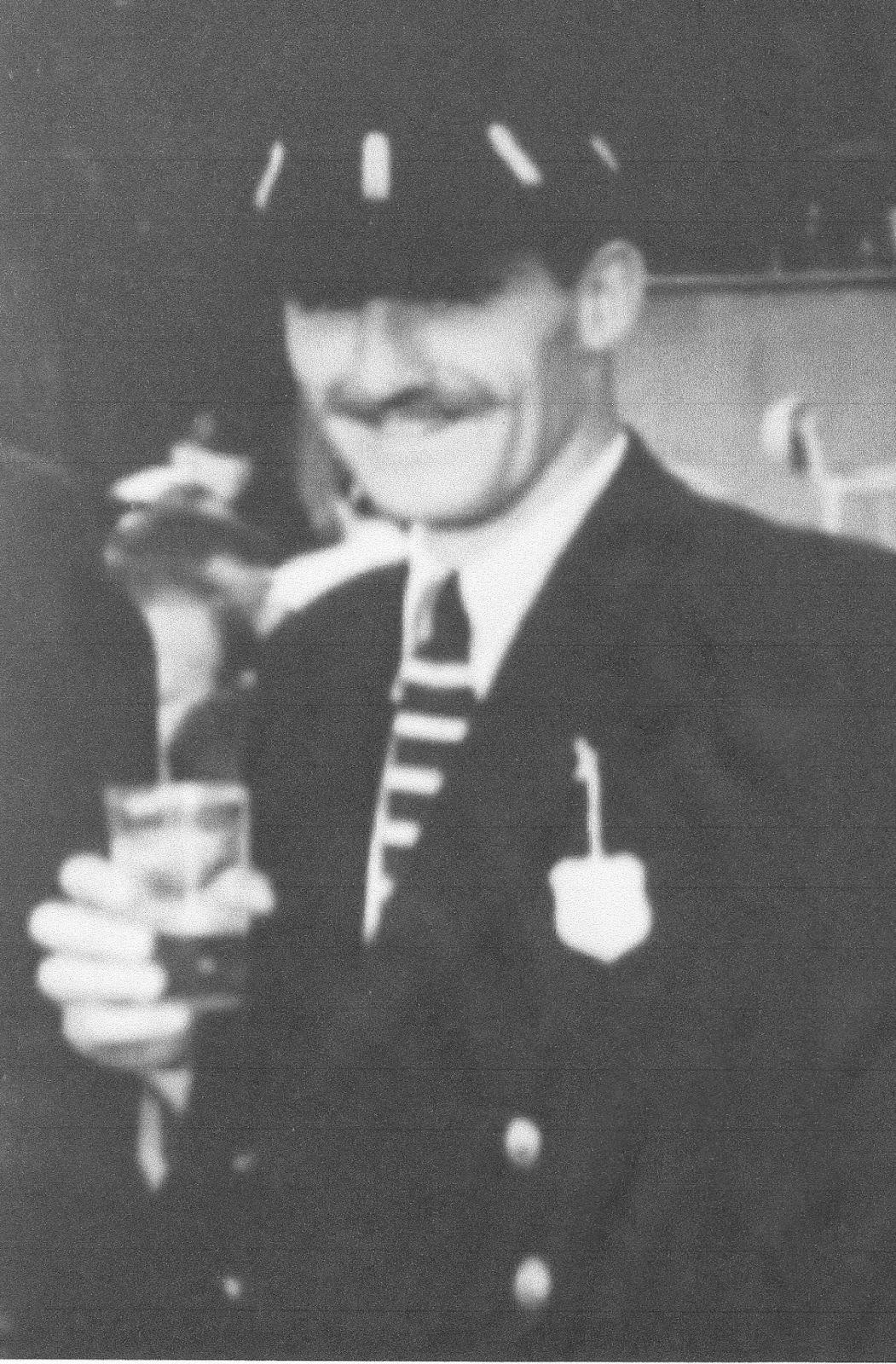 Graham Hill in London RC cap and tie at Henley.