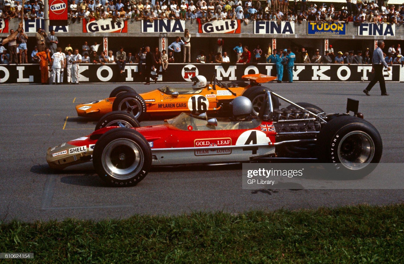 Jochen Rindt in a Lotus 49B and 2nd Denny Hulme in a McLaren M7A at the 1969 Italian Grand Prix in Monza. 