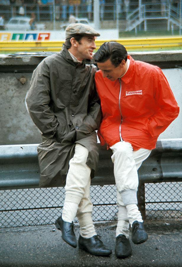 Jackie Stewart and Jim-Clark wearing racing rain coats in 60s.