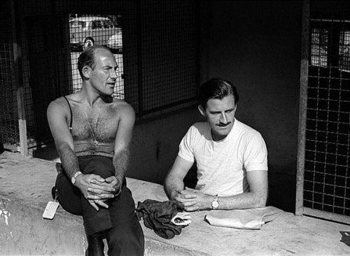 Stirling Moss with Graham Hill.