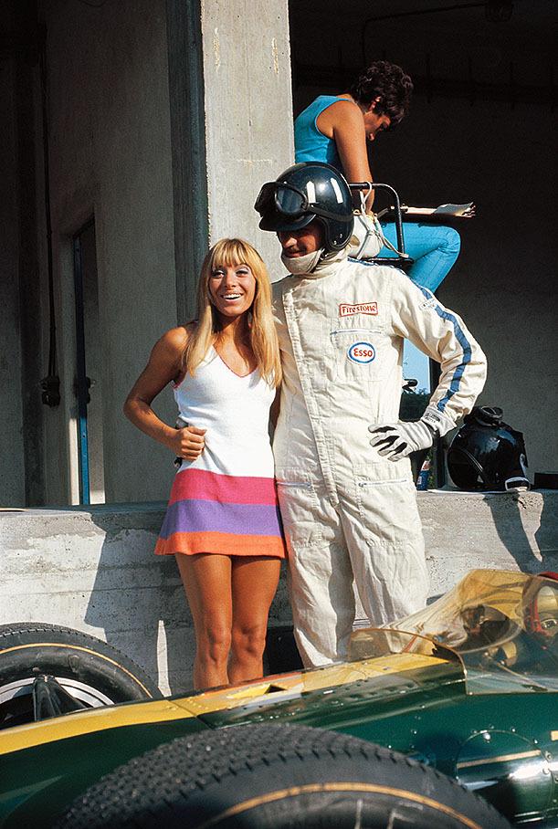 Graham Hill with a girl at Monza in 1968. 