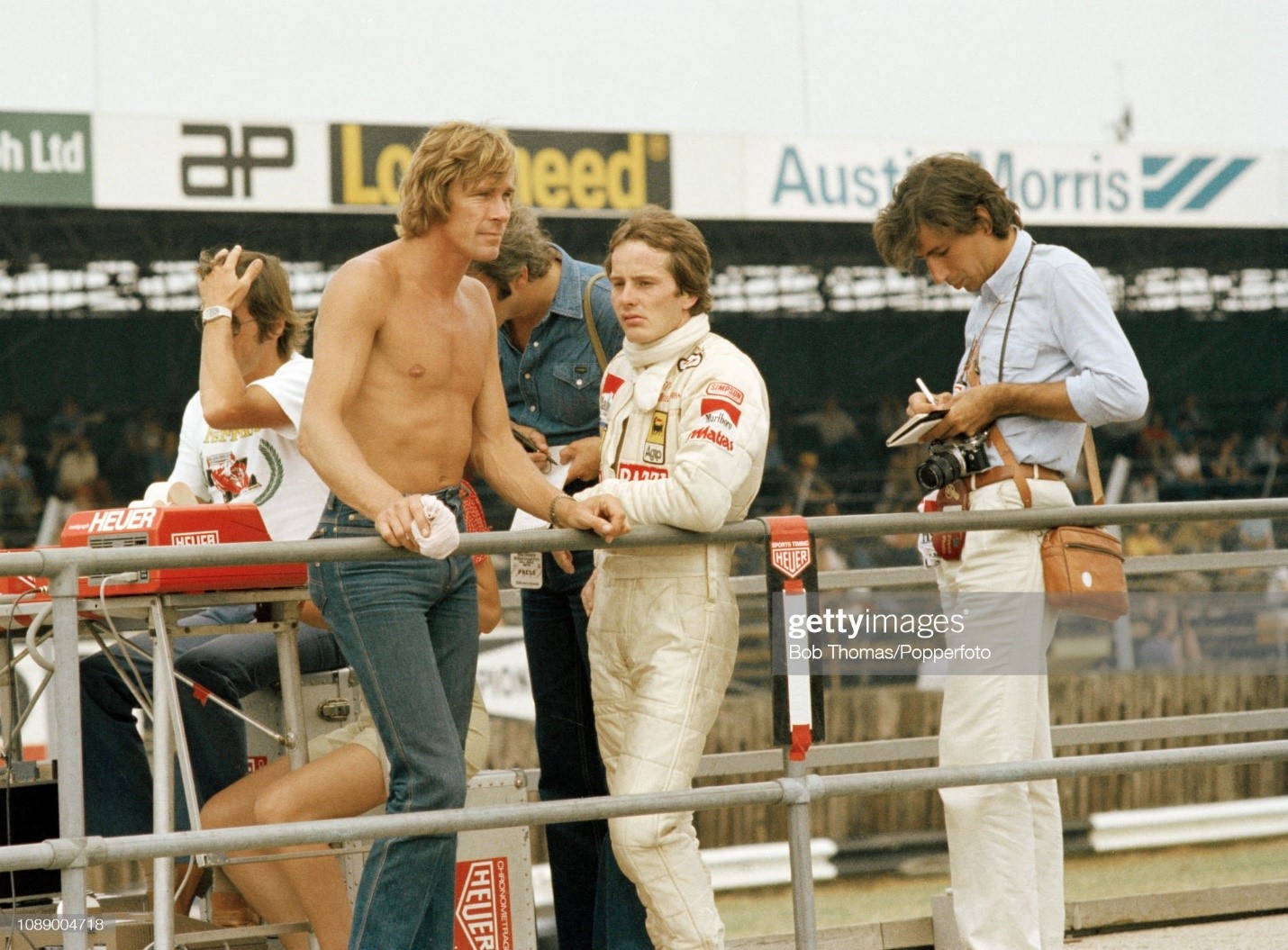 James Hunt and Gilles Villeneuve on the pitwall during the British Grand Prix at the Silverstone Circuit in Northampton, England, on July 14, 1979. 