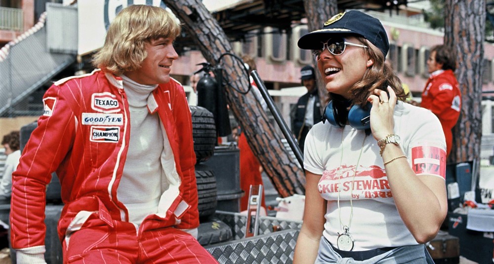 Relaxing in the pit lane during practice for the Monaco Grand Prix on 21 May 1977, James Hunt shares a joke with a young Princess Caroline of Monaco.