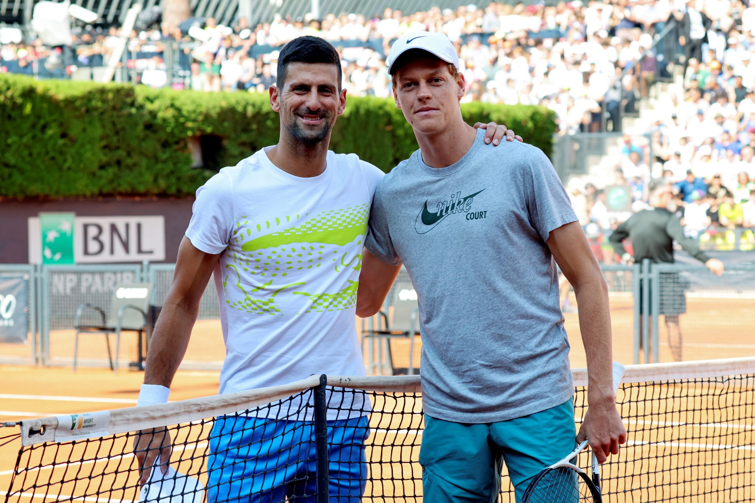 Jannik Sinner with Novak Djokovic.