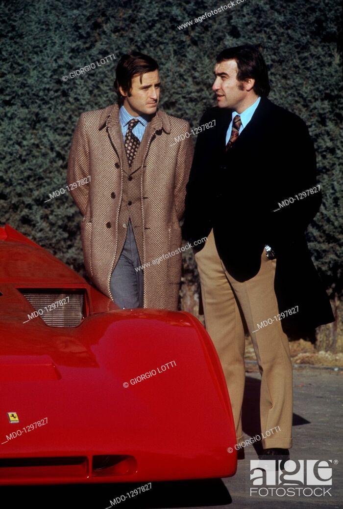 Ignazio Giunti with Clay Regazzoni in front of a red Ferrari.