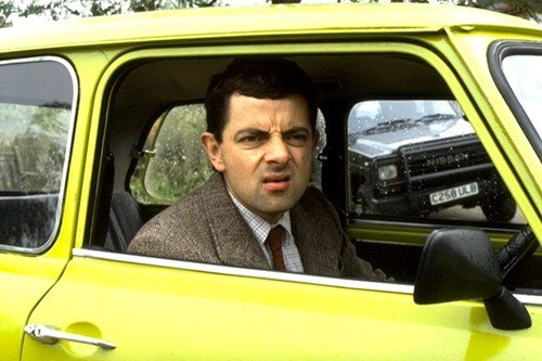 Mr. Bean in a Mini Cooper.