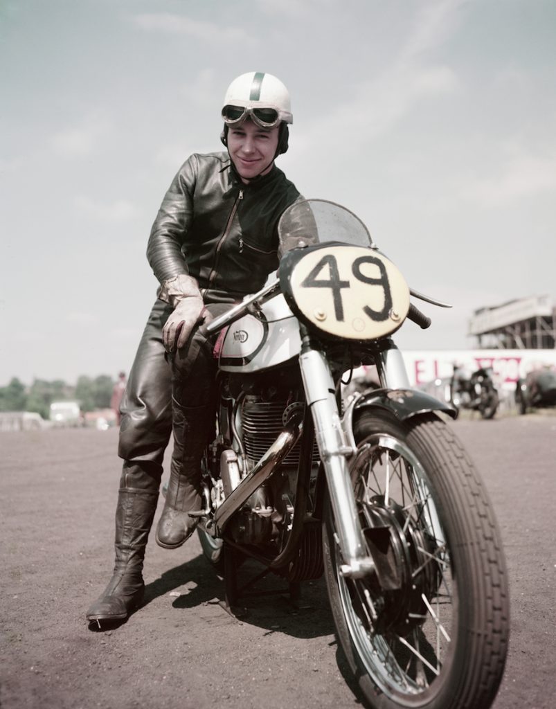 John Surtees riding a bike.