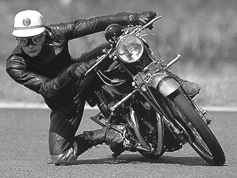 John Surtees riding a bike.