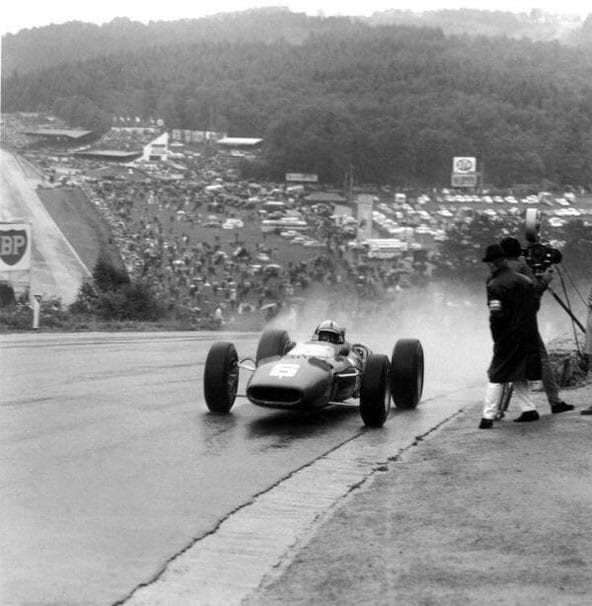 John Surtees in action under the rain.