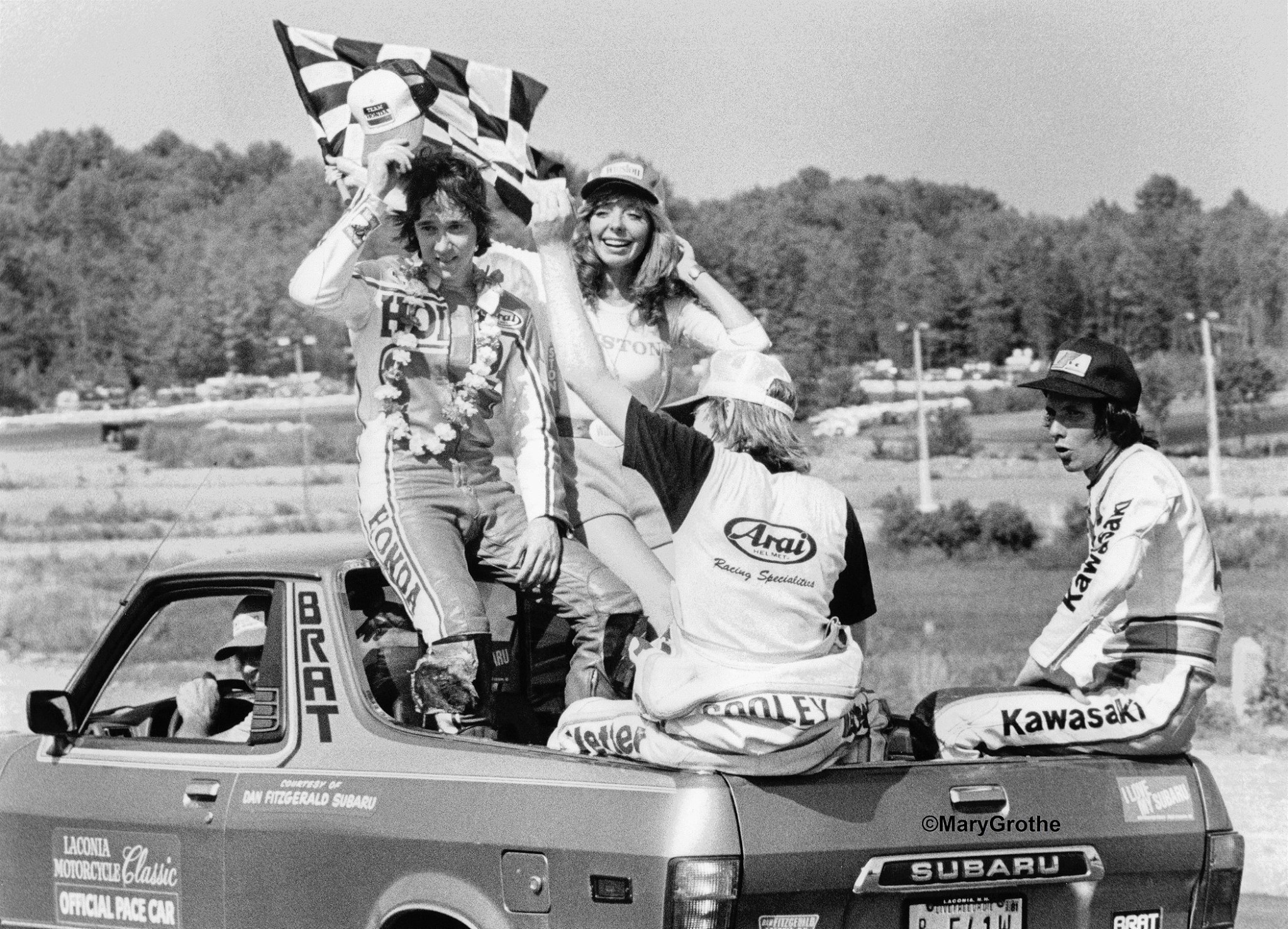 Lynn Griffis in a Subaru Brat with three guys that would achieve a little fame of their own in the near future…. 