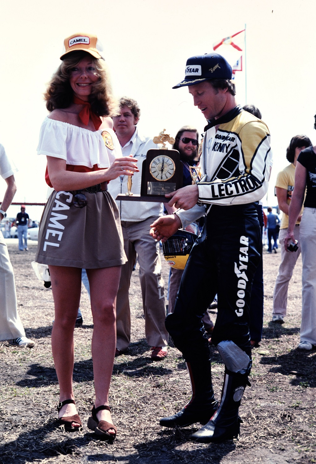 Kenny Roberts being presented a mantel clock from Miss Camel Lynn Griffis for winning the pole for the 1978 Daytona 200. In years to come the pole winners would get a Rolex watch.
