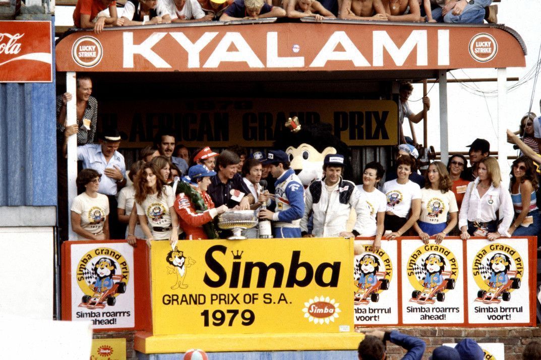South African GP 1979 at Kyalami. Gilles Villeneuve celebrates victory on the podium.