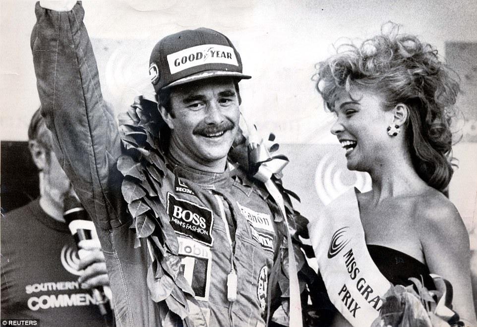 Mansell celebrating victory with 'Miss Grand Prix' in 1985.