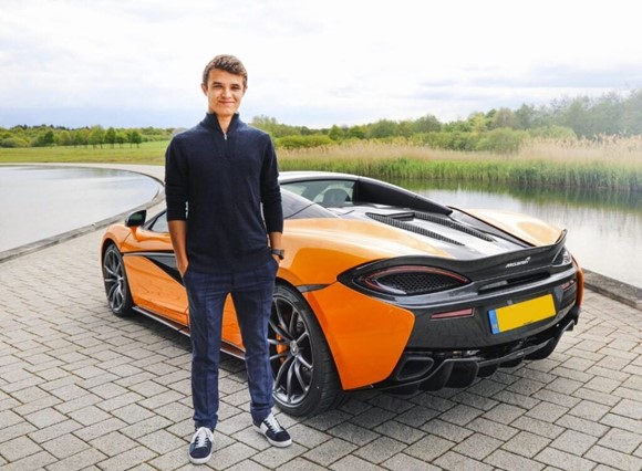 Lando Norris with one of his cars.