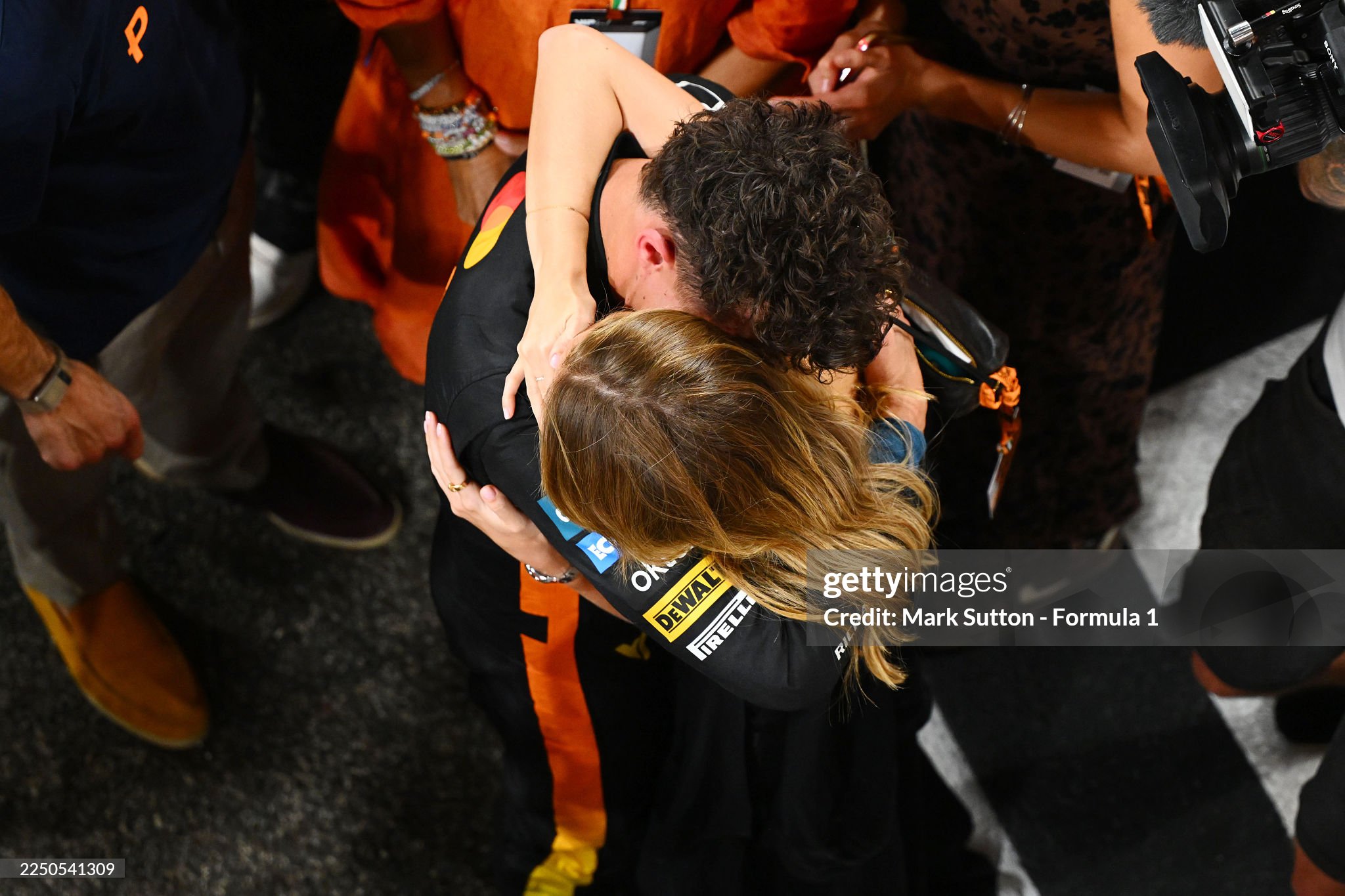 2025 F1 World Drivers Champion Lando Norris celebrates in parc ferme with Magui Corceiro after the Grand Prix of Abu Dhabi at Yas Marina Circuit on 07 December 2025 in Abu Dhabi, United Arab Emirates. 