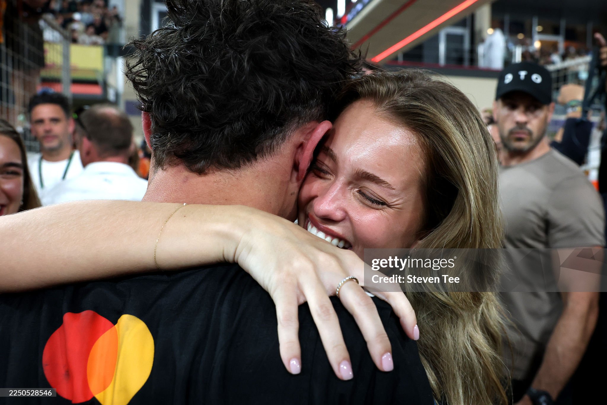 2025 F1 World Drivers champion and third placed Lando Norris of Great Britain and McLaren celebrates in parc ferme with Magui Corceiro after the Abu Dhabi Grand Prix at Yas Marina circuit on 07 December 2025. 