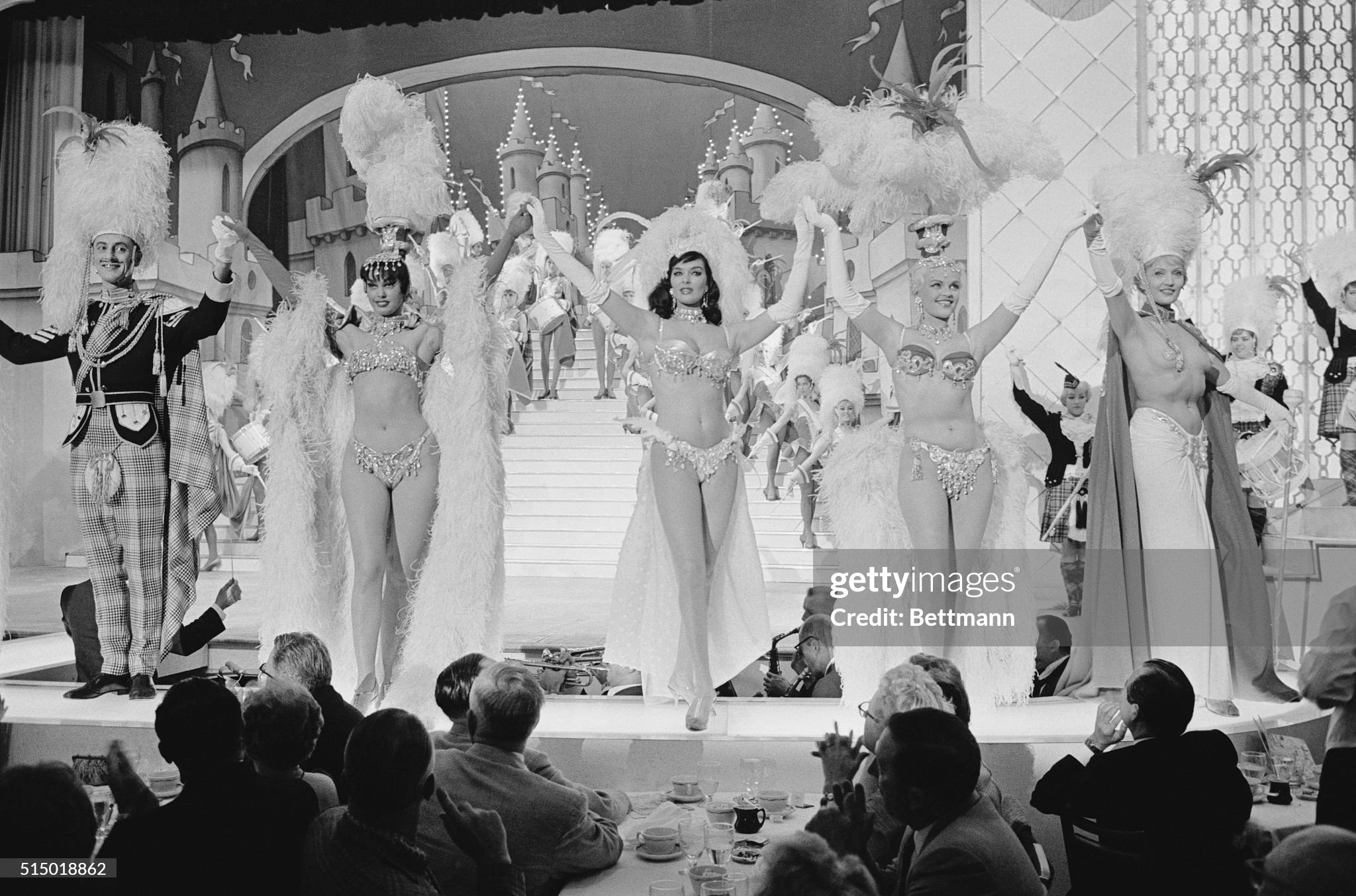 Girls in the limelight. A fairy tale world of beauty and color exists beyond the footlights at Las Vegas' Hotel Tropicana, where nightly girls of the Folies Bergers dazzle patrons with resplendent costumes and exciting motion on 24 February 1962. 