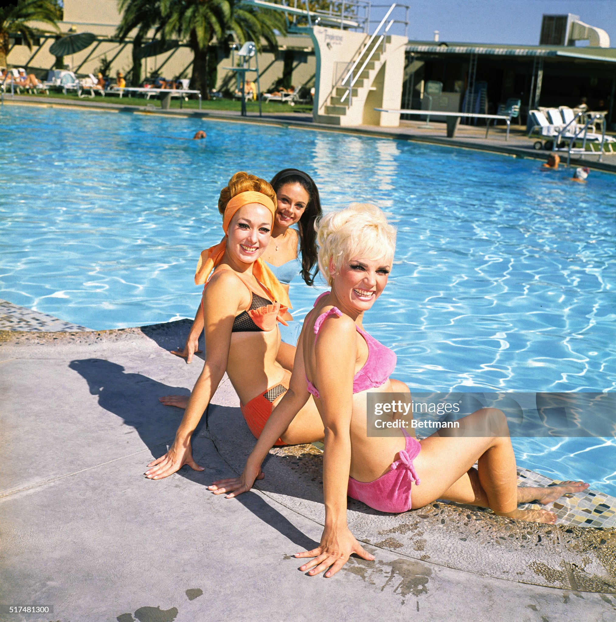 Poolside: the girls, who all dance in the Folies Bergere at the plush Hotel Tropicana, Las Vegas, in 1968 are: Virginia Justus, the blonde; Lydia Torea, the redhead; and the brunet, Sharon Cunningham. The Torea gal was once a partner of Jose Greco. 