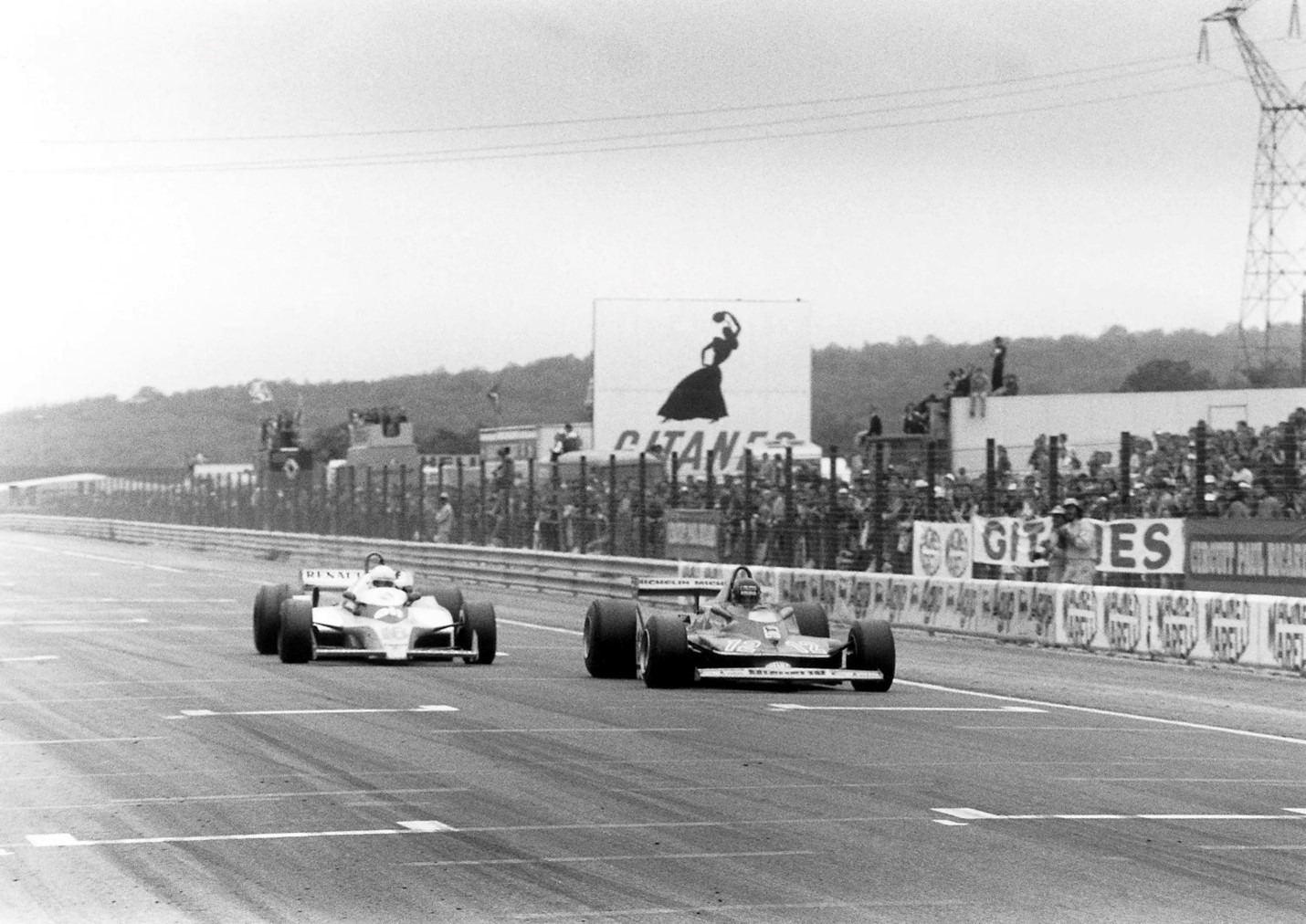 Gilles Villeneuve, Ferrari 312T4, leads Rene Arnoux, Renault RS10, at the finish after their epic battle. They finished in 2nd and 3rd position respectively. 