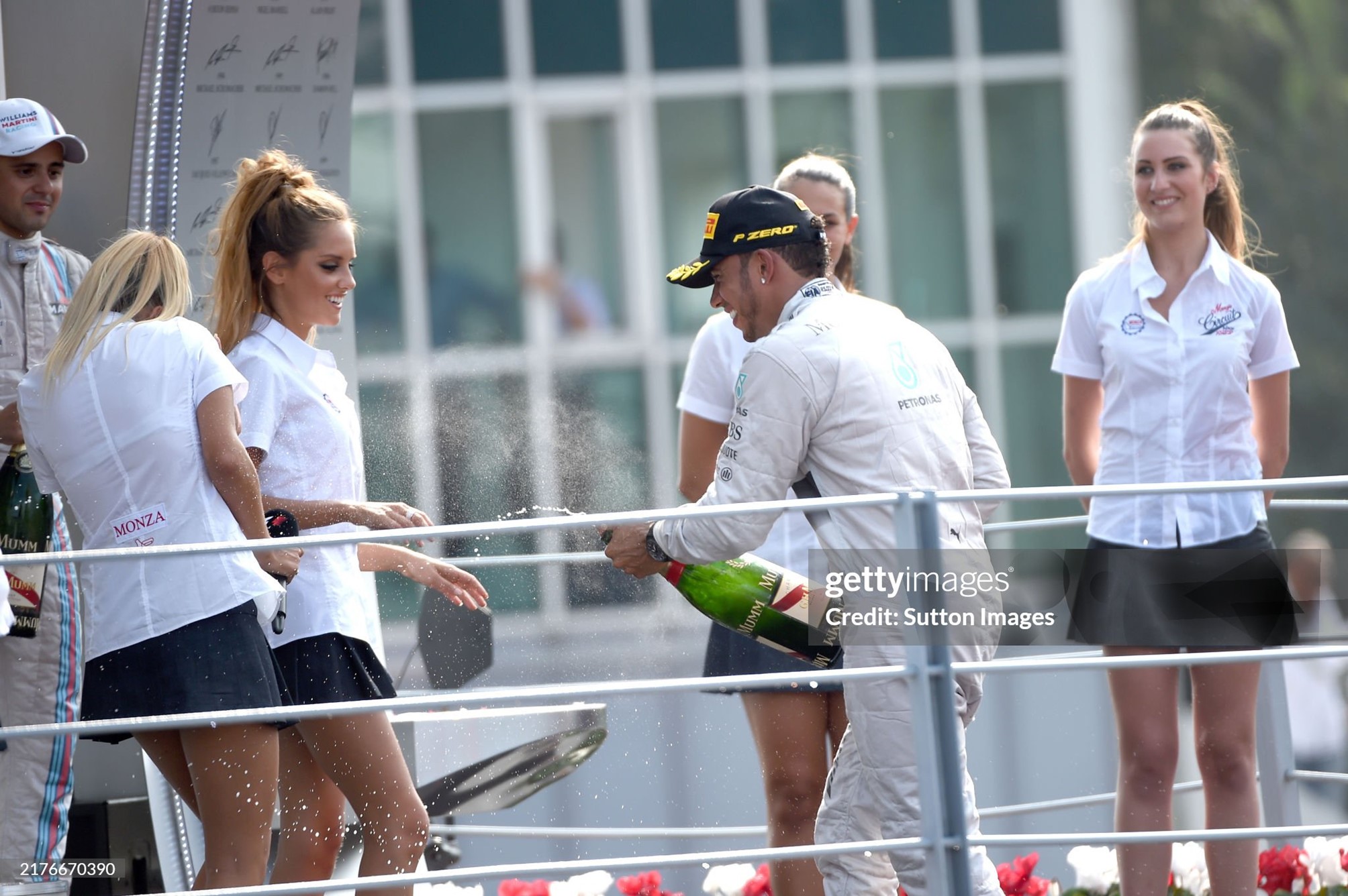 Race winner Lewis Hamilton, Mercedes, celebrates on the podium with the grid girls and the champagne at the Italian Grand Prix in Monza on Sunday 07 September 2014. 