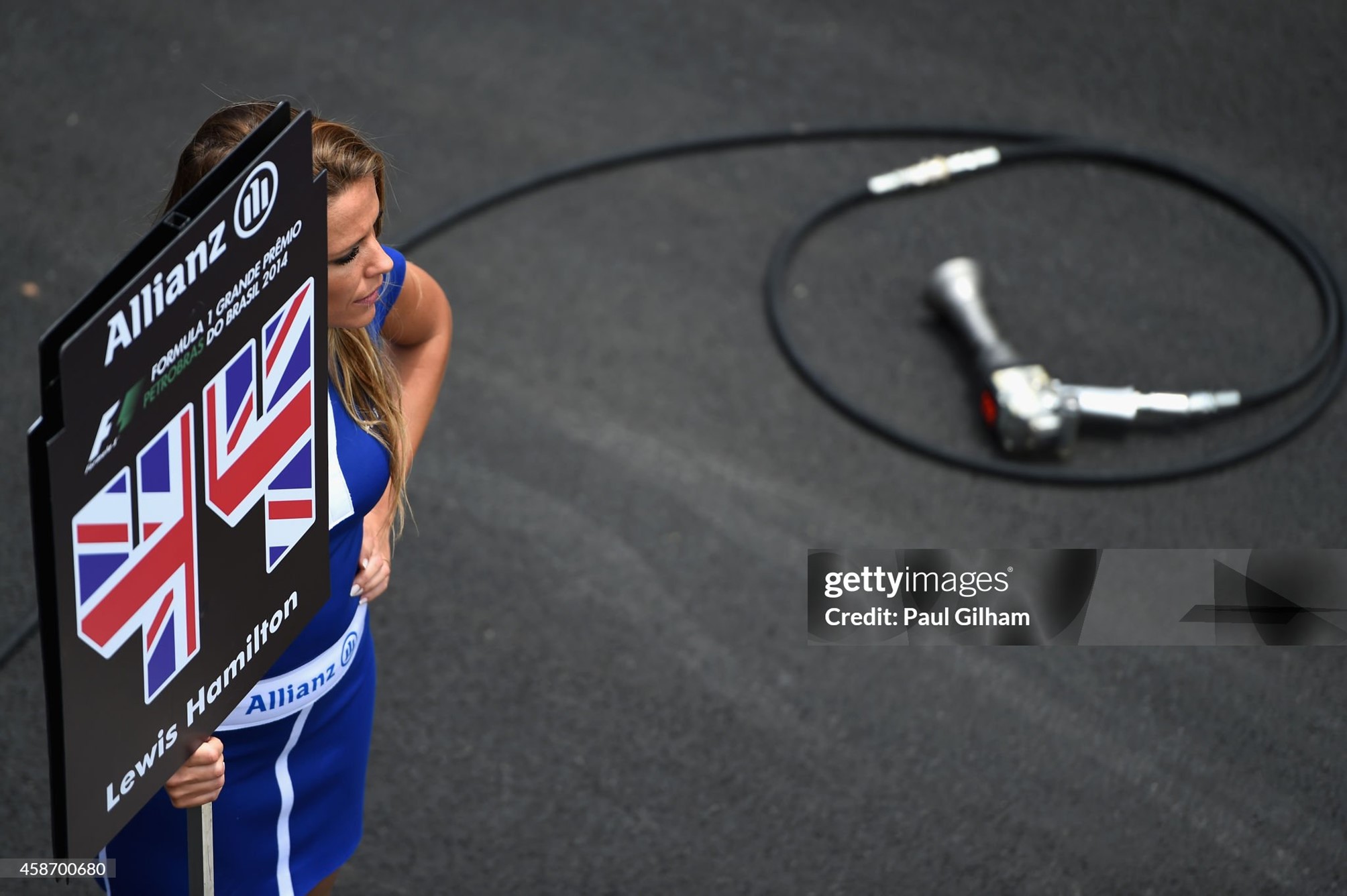 A grid girl stands next to Lewis Hamilton 's starting position on the grid before the Brazilian Formula One Grand Prix at Autodromo Jose Carlos Pace on 09 November 2014 in Sao Paulo, Brazil. 