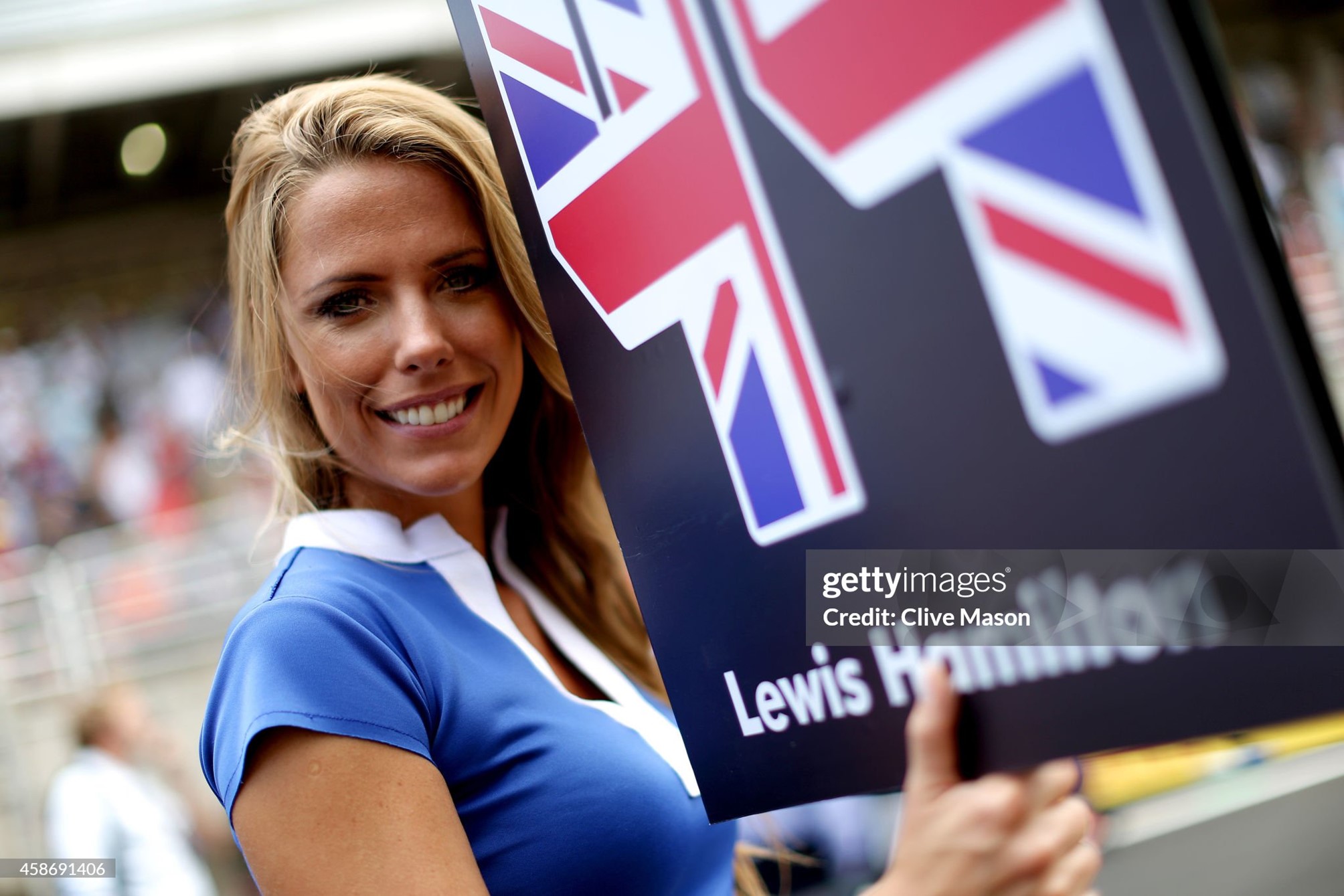 A grid girl stands next to Lewis Hamilton 's starting position on the grid before the Brazilian Formula One Grand Prix at Autodromo Jose Carlos Pace on 09 November 2014 in Sao Paulo, Brazil. 