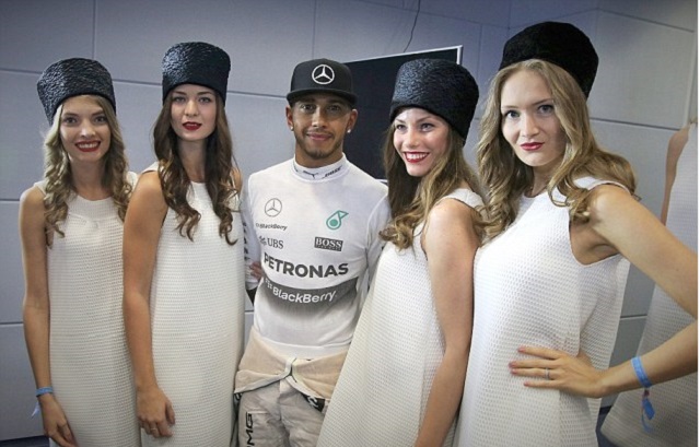 Lewis Hamilton with grid girls in Sochi at the Russian Grand Prix on 9-11 October 2015. Today it was announced that the glamorous pit girls will not feature in the upcoming racing season.