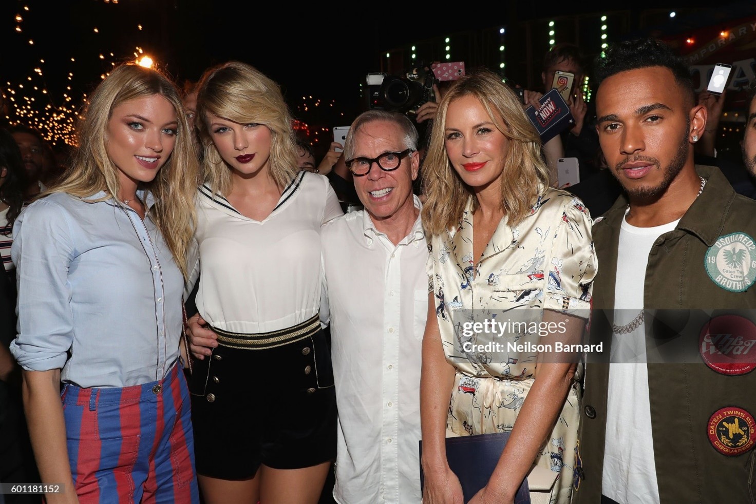 (L-R) Martha Hunt, Taylor Swift, Tommy Hilfiger, Dee Hilfiger and Lewis Hamilton attend the TOMMYNOW Women's Fashion Show during New York Fashion Week at Pier 16 on 09 September 2016. 