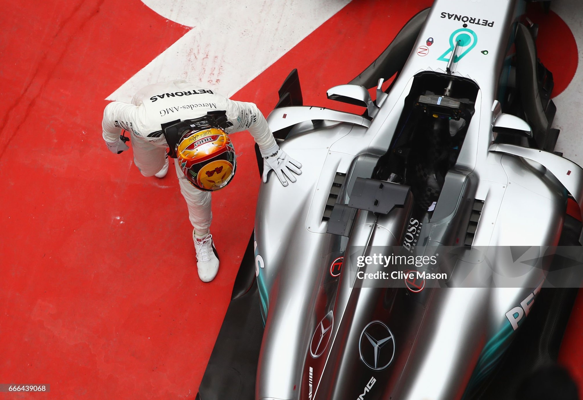 Race winner Lewis Hamilton strokes his car in parc ferme during the Formula One Grand Prix of China at Shanghai International Circuit on 09 April 2017. 