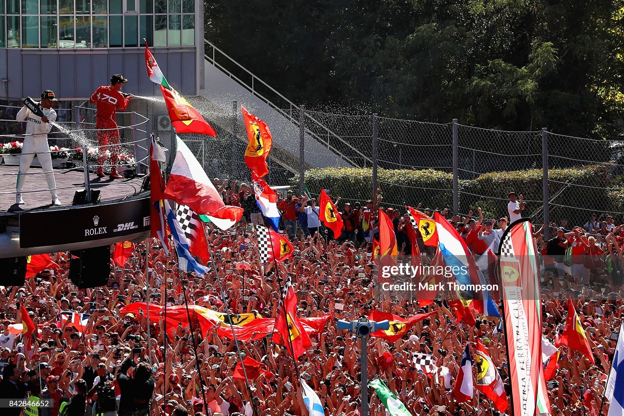 Race winner Lewis Hamilton and Sebastian Vettel celebrate on the podium after the Grand Prix of Italy at Autodromo di Monza on 03 September 2017. 