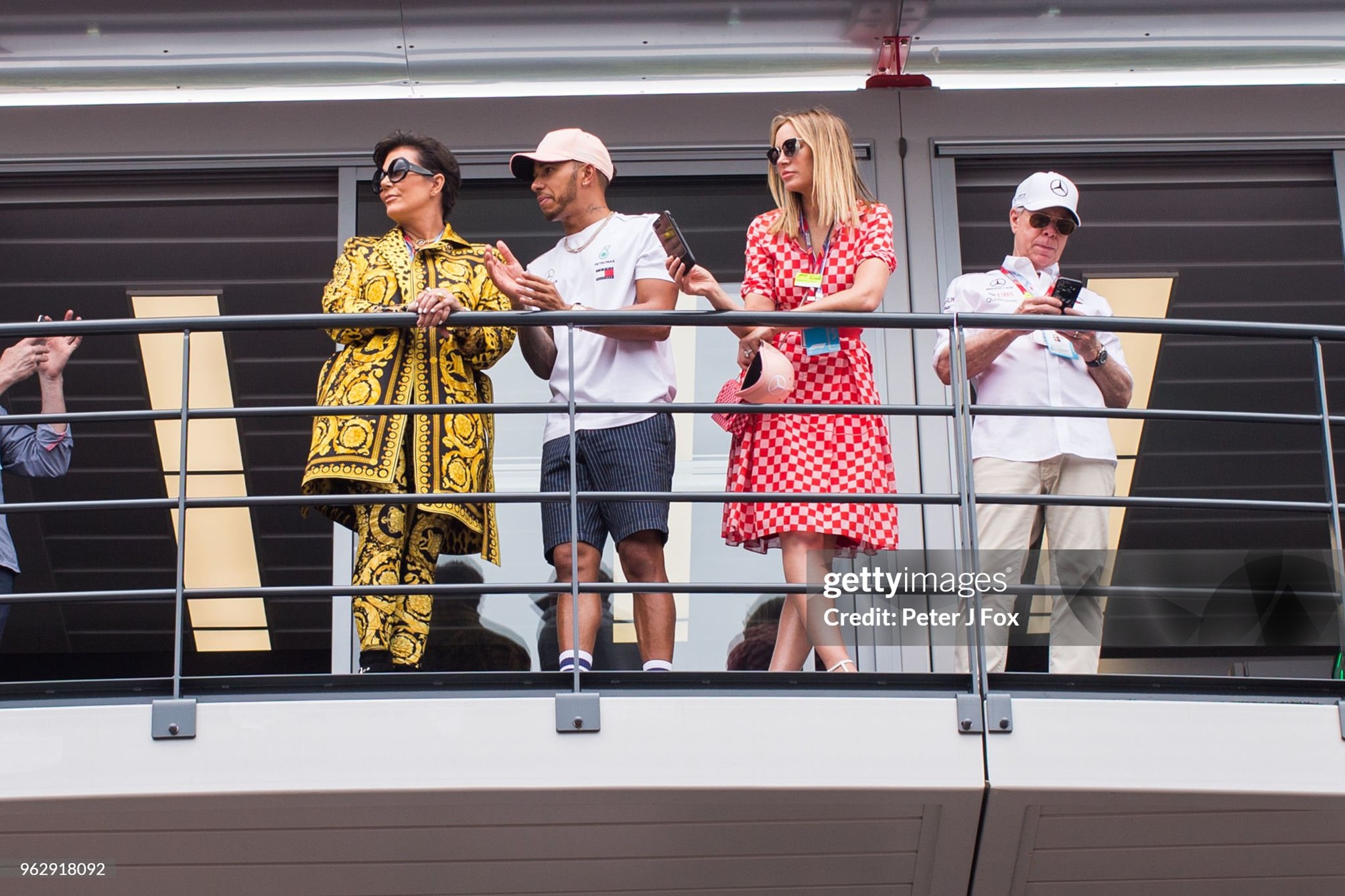 Lewis Hamilton of Mercedes and Great Britain chats with Kris Jenner as Dee Hilfiger and Tommy Hilfiger look on during the Monaco Formula One Grand Prix at Circuit de Monaco in Monte-Carlo, Monaco, on 27 May 2018. 