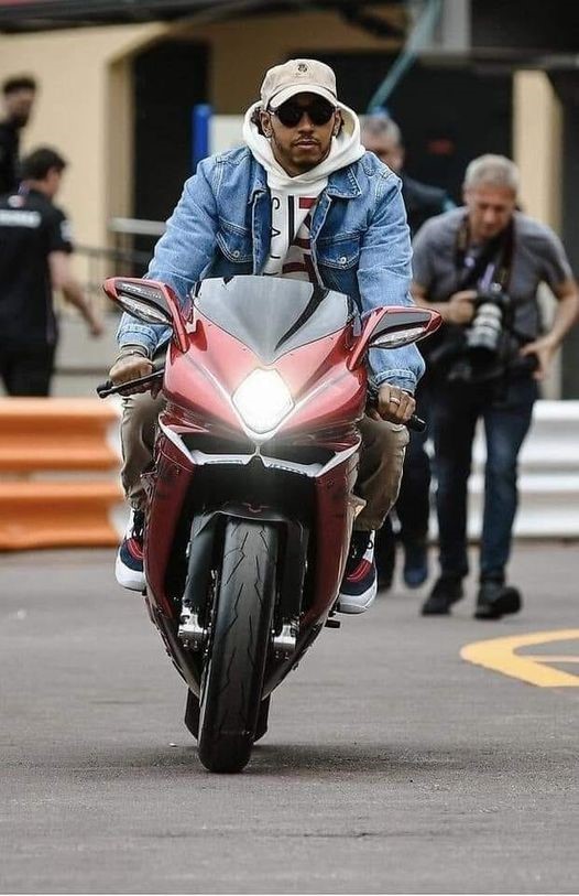 Lewis Hamilton on his motor bike in the paddock at the Circuit de Monaco on 22 May 2019.