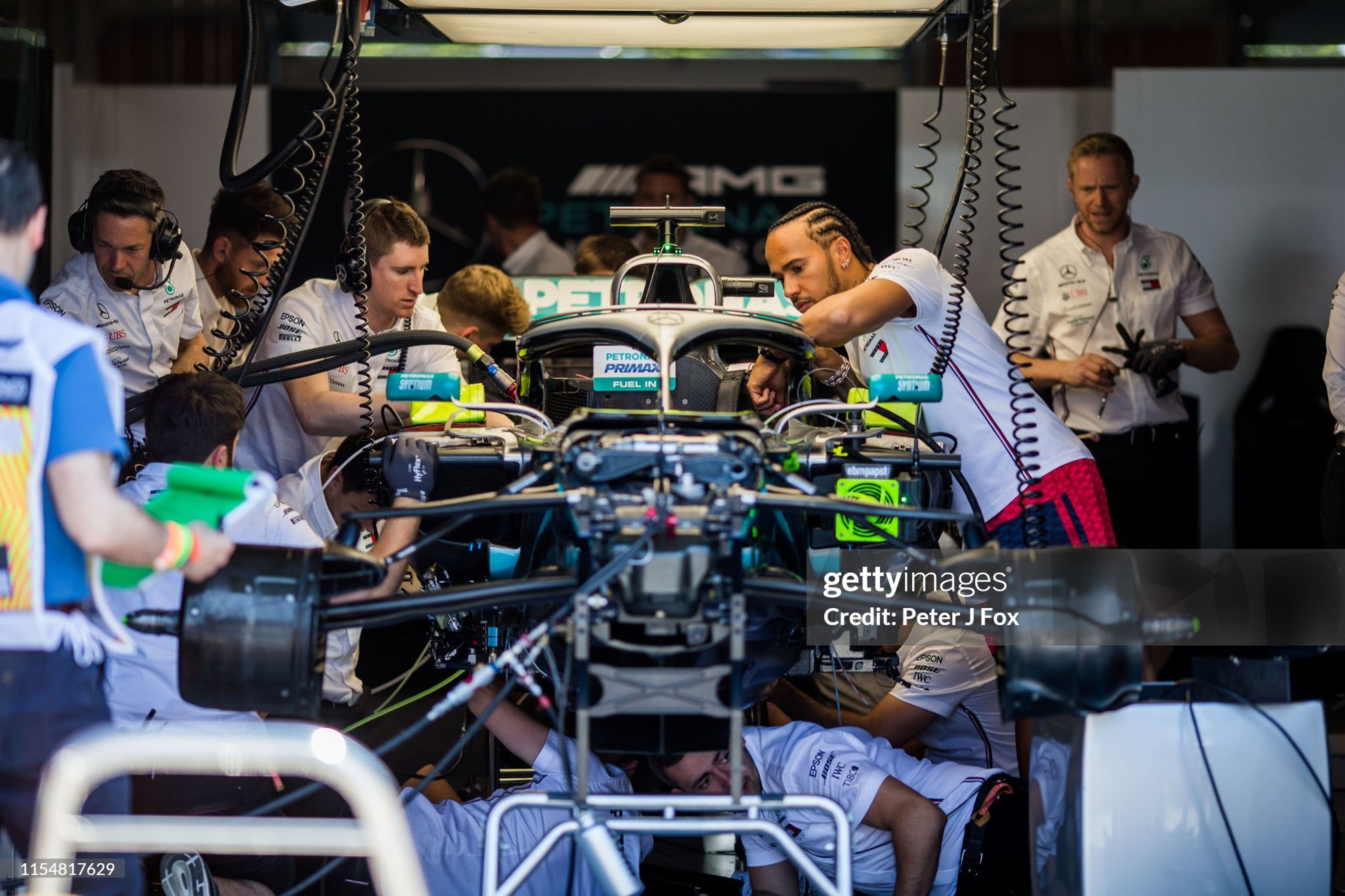 Lewis Hamilton inspects his Mercedes whilst his mechanics try to fix an issue with the car before the F1 Grand Prix of Canada at Circuit Gilles Villeneuve in Montreal on 09 June 2019. 