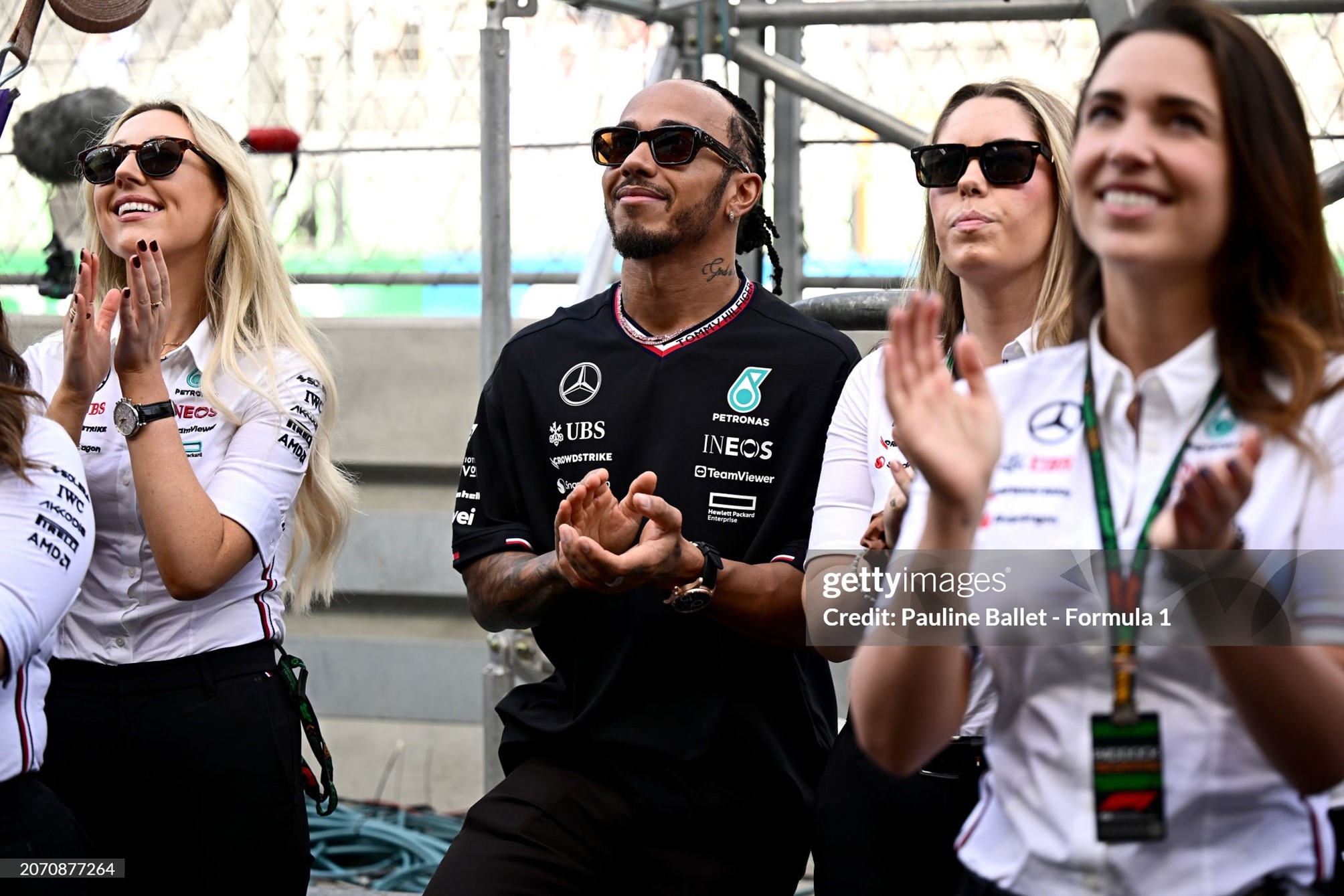 Lewis Hamilton watches the podium celebrations after race 2 of the F1 Academy at Jeddah Corniche Circuit on 09 March 2024 in Jeddah, Saudi Arabia. 