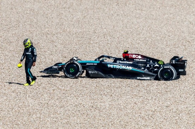 Lewis Hamilton, Mercedes F1 W15, walks away from his car after retiring in the gravel during the F1 Grand Prix of United States at Circuit of The Americas on October 20, 2024. 