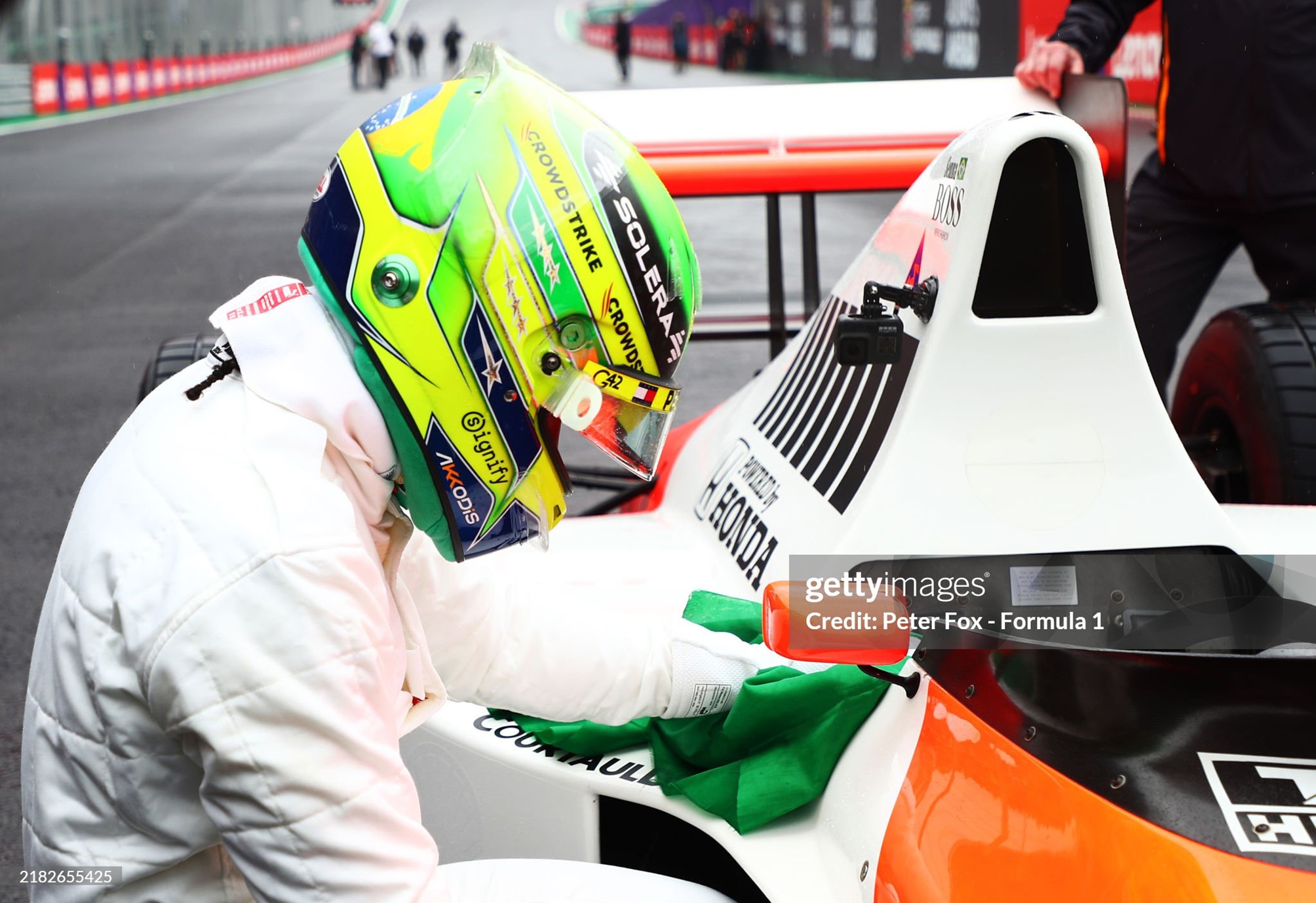 Lewis Hamilton acknowledges the car after driving the 1990 McLaren MP45 in tribute to the late Ayrton Senna on track prior to the F1 Grand Prix of Brazil at Autodromo Jose Carlos Pace on November 03, 2024. 