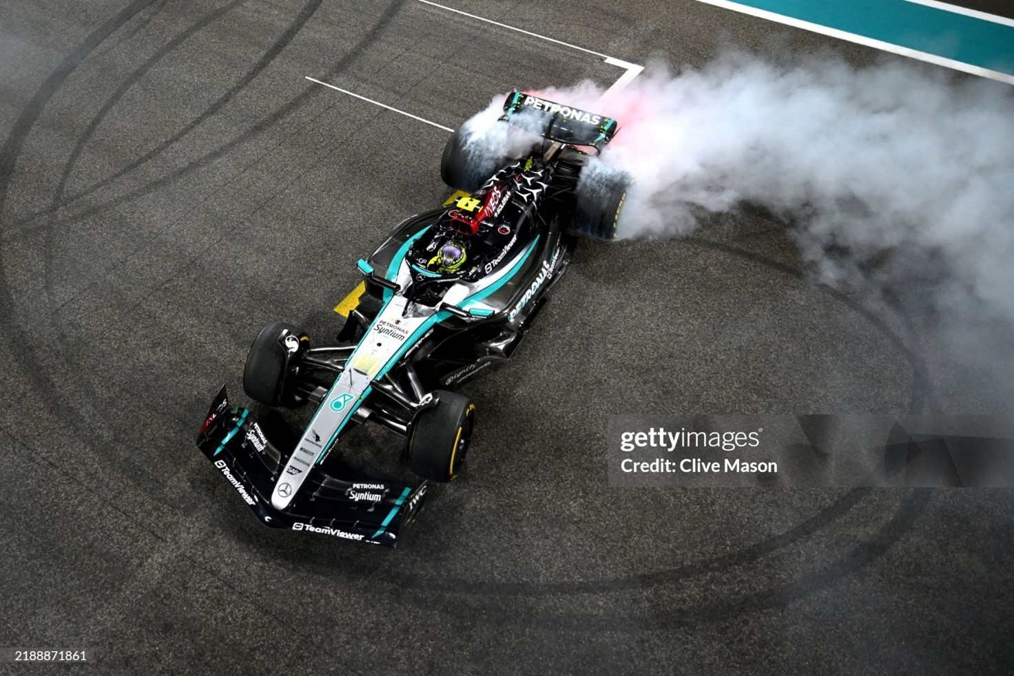 4th placed Lewis Hamilton does donuts on track to celebrate his final race with Mercedes after the F1 Grand Prix of Abu Dhabi at Yas Marina Circuit on December 08, 2024. 