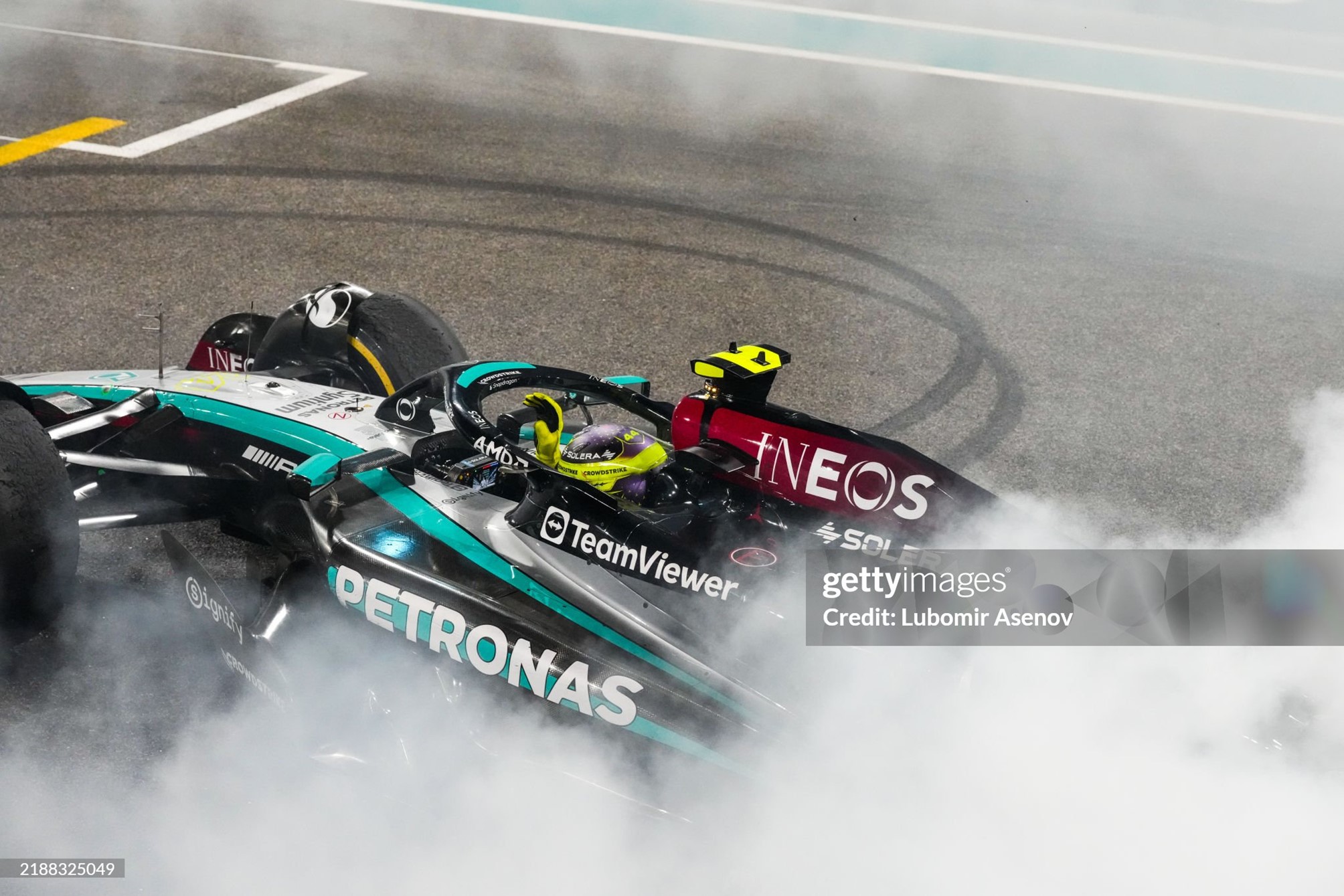 Lewis Hamilton performs donuts on track to celebrate his final race with Mercedes after the F1 Grand Prix of Abu Dhabi at Yas Marina Circuit on December 08, 2024. 