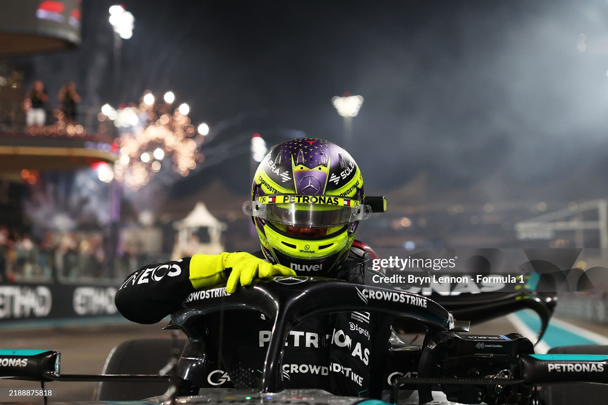 4th placed Lewis Hamilton climbs from his car after performing donuts on track for his final Grand Prix with Mercedes at Abu Dhabi on December 08, 2024. 