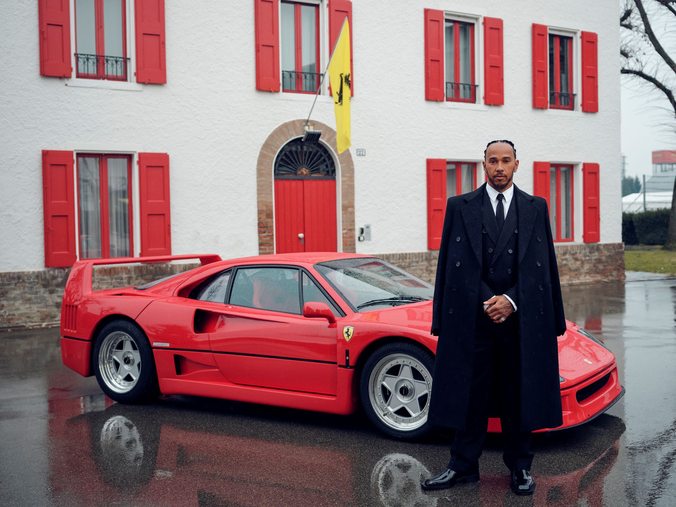 Lewis Hamilton at Maranello in front of a Ferrari F40. 