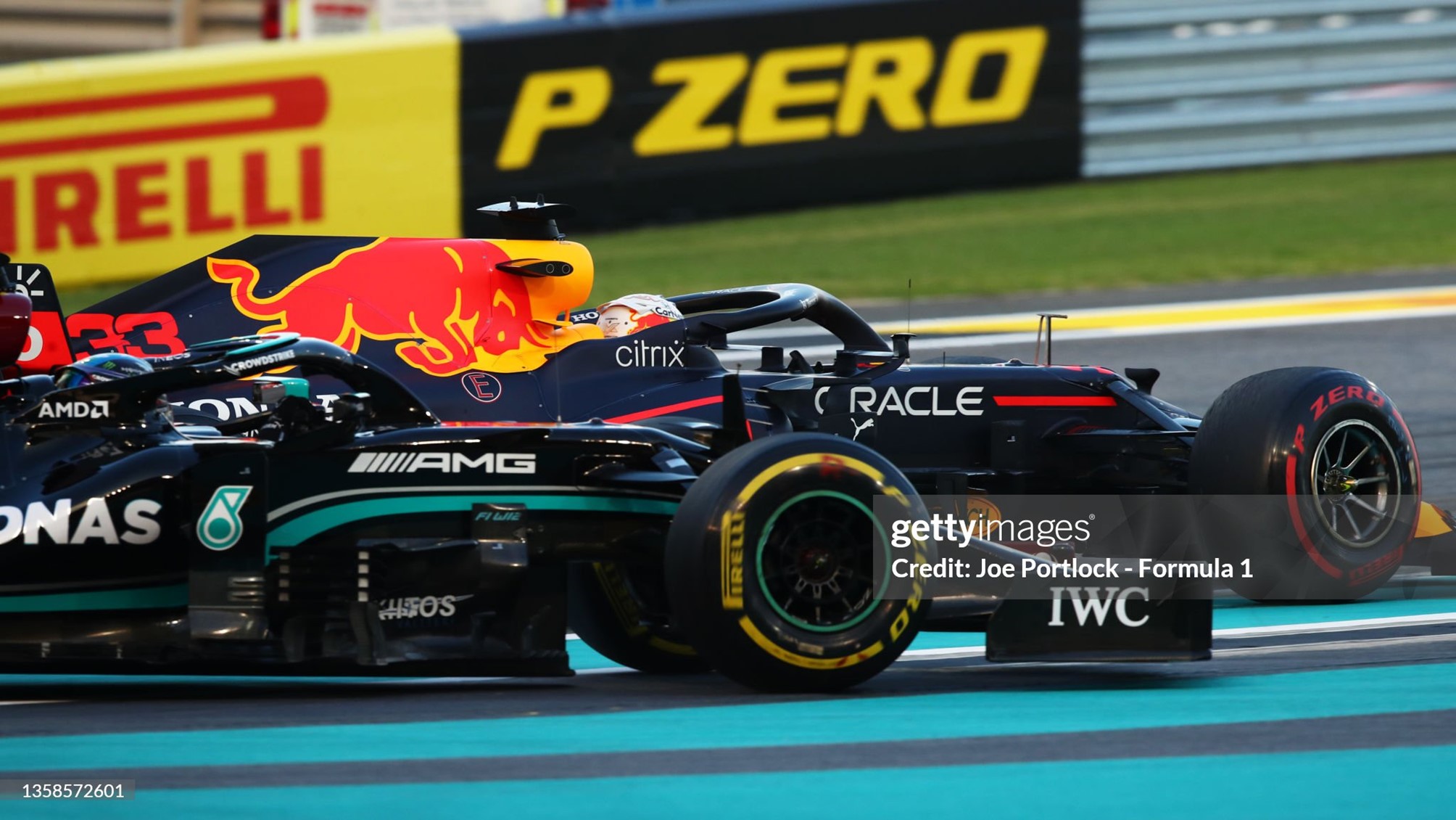 Max Verstappen driving the Red Bull and Lewis Hamilton driving the Mercedes battle for position during the F1 Grand Prix of Abu Dhabi at Yas Marina Circuit on 12 December 2021 in Abu Dhabi, United Arab Emirates. 