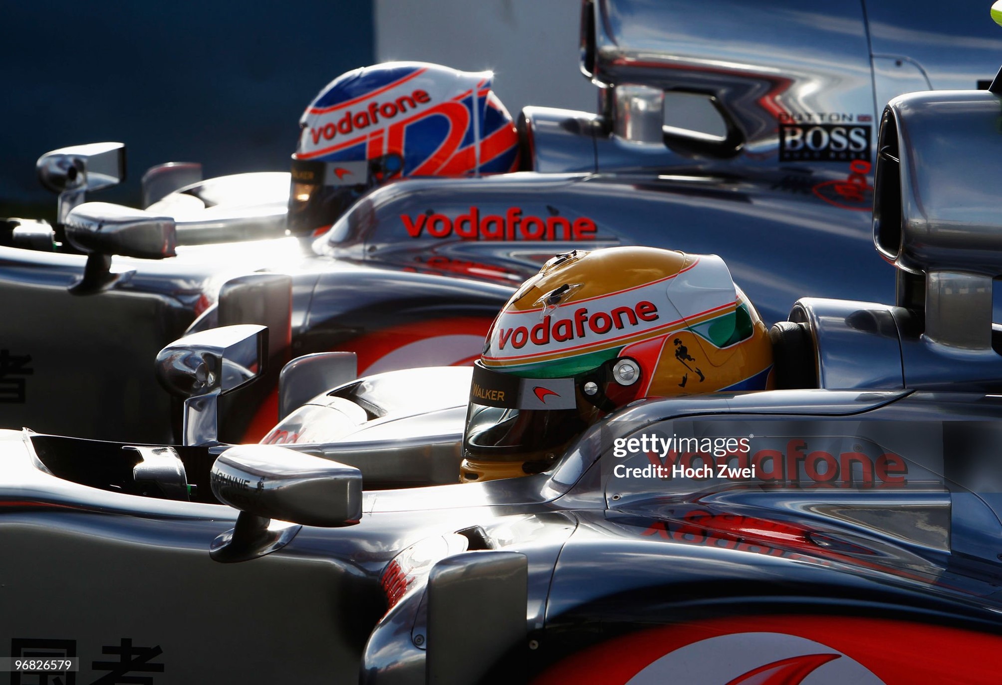 Jenson Button (top) of Great Britain and McLaren Mercedes and Lewis Hamilton (bottom) of Great Britain and McLaren Mercedes sit side by side in their cars during winter testing at the Circuito de Jerez on 08 February 2010 in Jerez de la Frontera, Spain. 