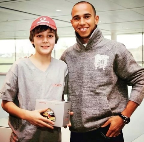 A 12 year old George Russell meeting Lewis Hamilton in 2010 at a McLaren factory tour.