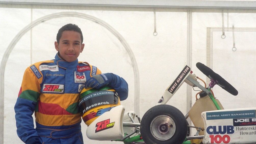 A young Lewis Hamilton and his kart.