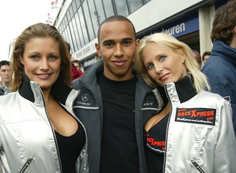 Lewis Hamilton with two large breasted women at Zandvoort, Holland, in June 2005.