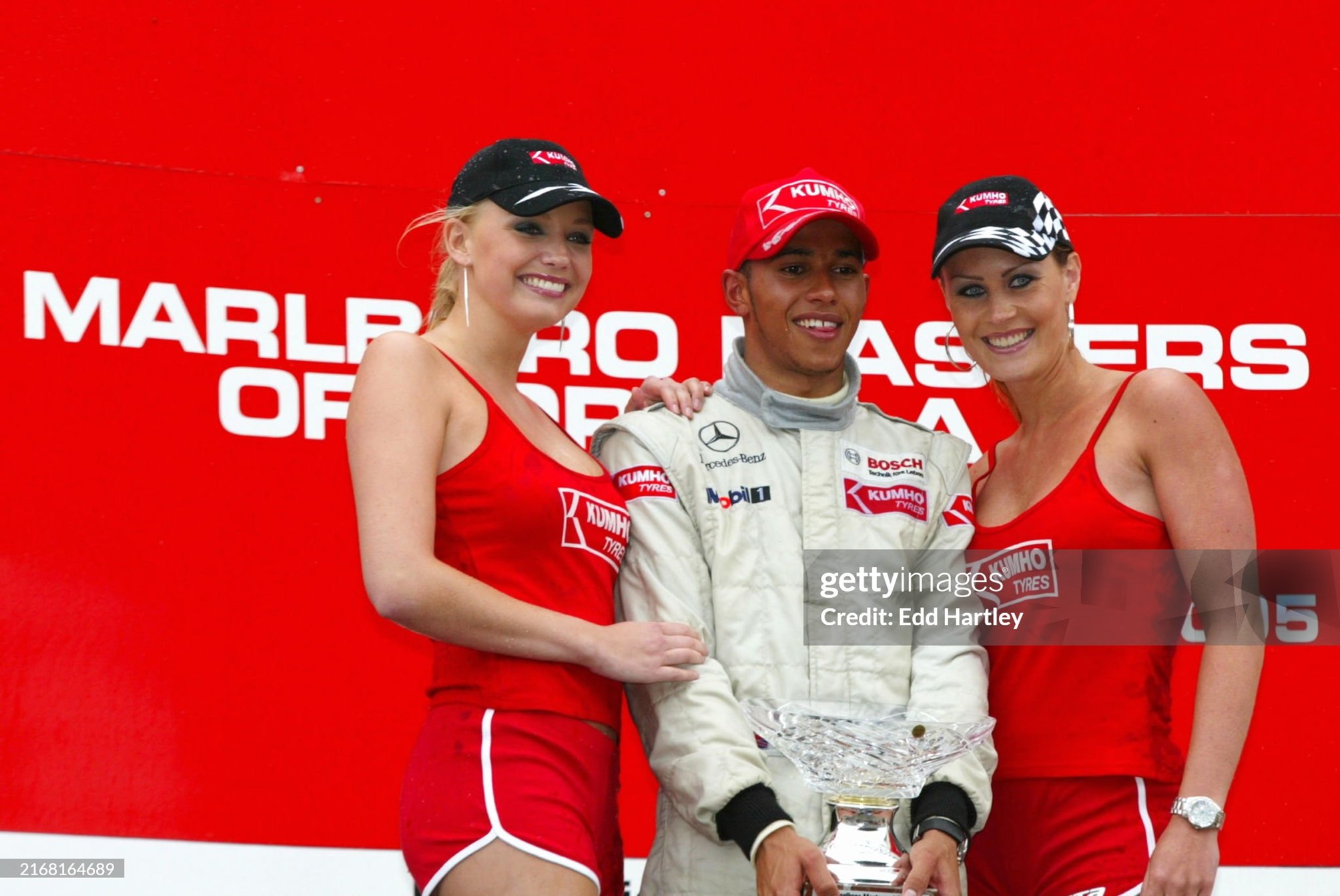 Race winner Lewis Hamilton, ASM F3 Dallara, celebrates with Kumho girls on the podium at the Marlboro Masters of F3 in Zandvoort, Holland, on 12 June 2005. 