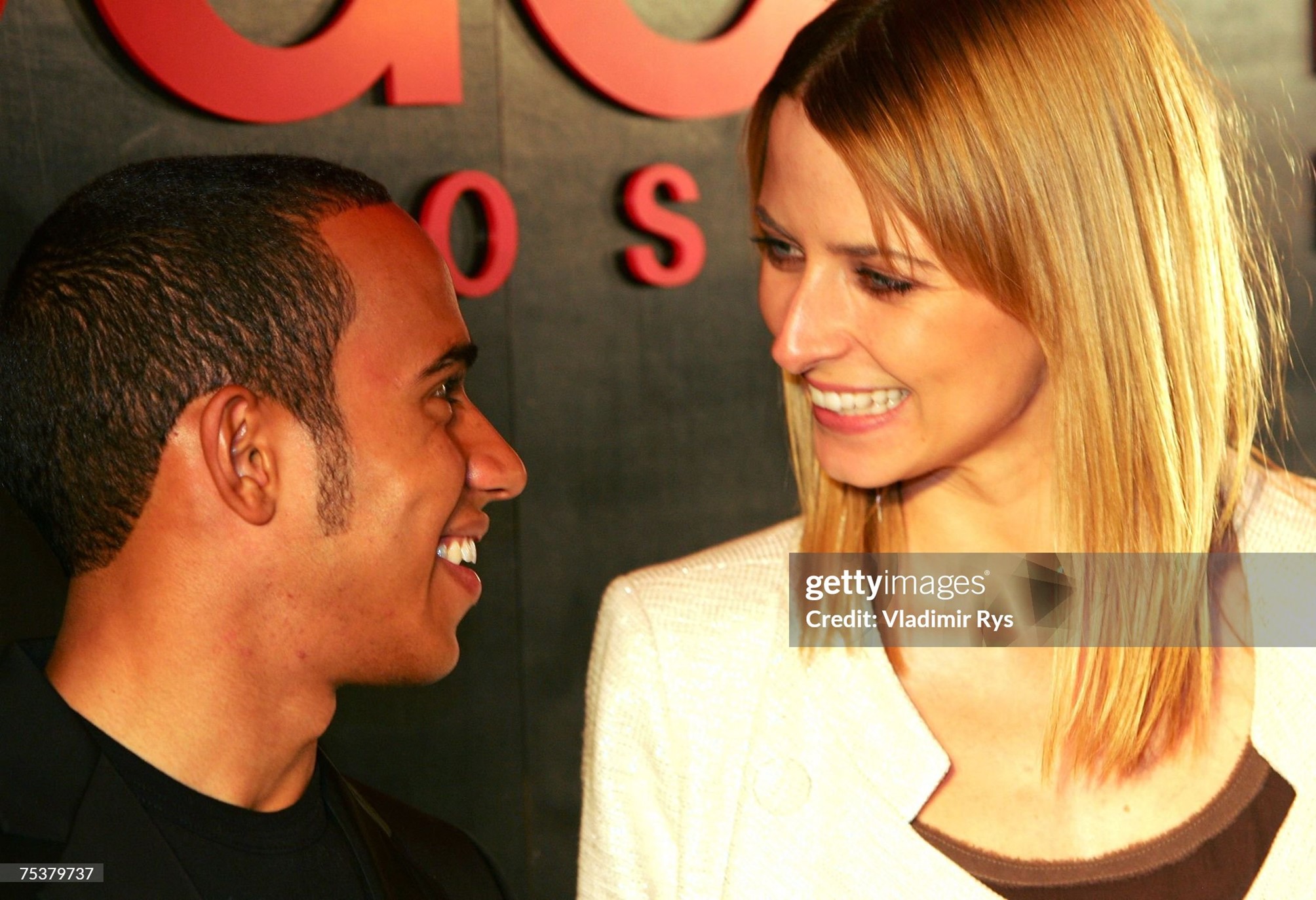 Lewis Hamilton and German top model Eva Padberg attend the Hugo Boss fashion show held at Brandenburg Gate on 12 July 2007 in Berlin, Germany. 